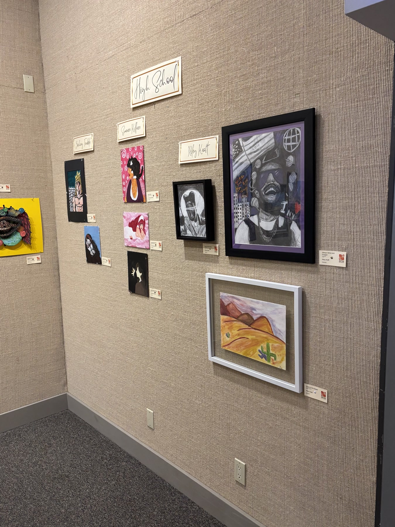 Canvas Vault artworks displayed together on an exhibition wall